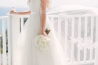 26 modern spaghetti strap wedding dress with a tulle skirt