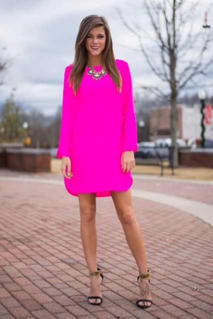 neon pink dress, ankle strap heels and a statement necklace