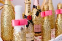 27 glitter champagne bottles as bridal shower favors