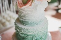 27 ruffle ombre mint wedding cake topped with peach flowers