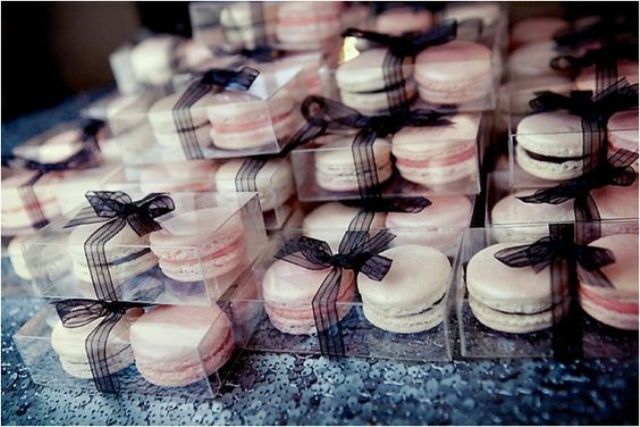 blush and ivory macarons tied with black ribbon