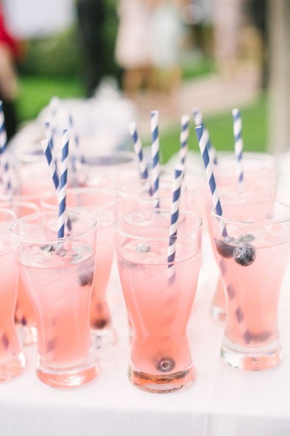 blush drinks with blueberries and striped navy and white straws