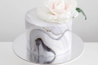 28 marble grey one-tier wedding cake with a sparkel topped with a large bloom