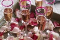 28 pink glitter rim champagne flutes and rose petals
