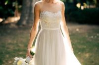 29 bateau neckline illusion dress with a lace top and a tulle skirt