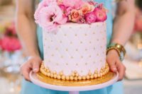 30 blush and gold cake topped with bold pink flowers