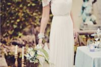 30 lace illusion neckline wedding dress with a pleated skirt