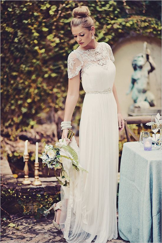 lace illusion neckline wedding dress with a pleated skirt
