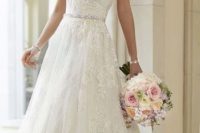 30 lace wedding gown with an embellished sash and a train