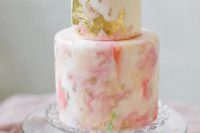 30 peach marble wedding cake  with gold leafing and topped with peach flowers