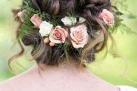 31 blush roses and greenery tucked into the wedidng hair