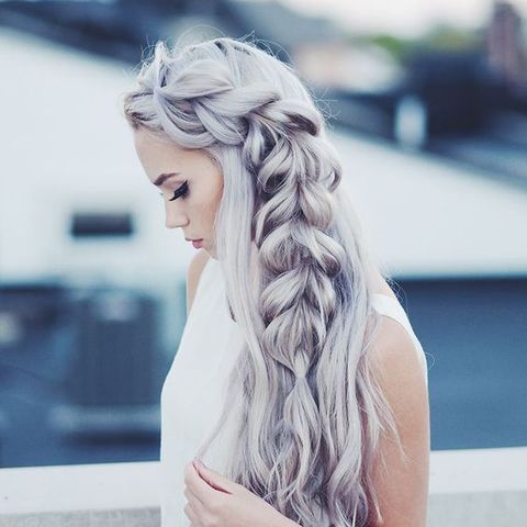 loose side swept hair with a braid in trendy silver grey color