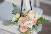 31 navy and ivory flowers and a navy ribbon to decorate the aisle