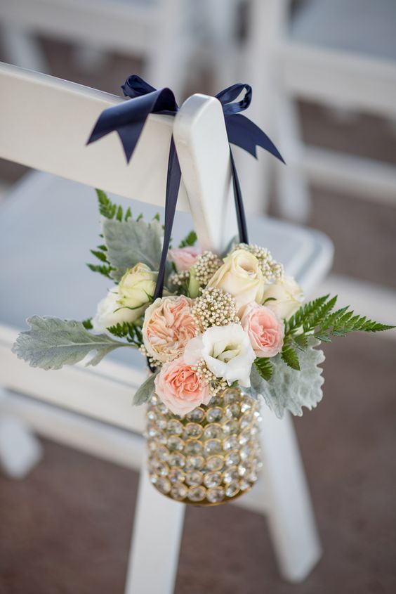 navy and ivory flowers and a navy ribbon to decorate the aisle
