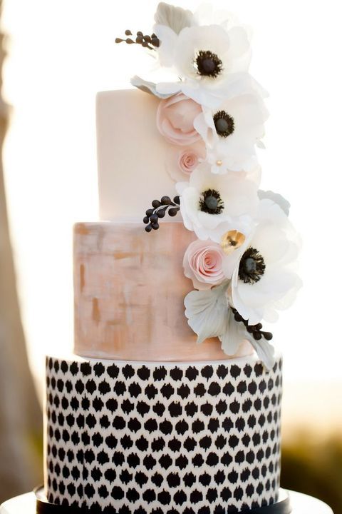 unique wedding cake with ivory, blush and black tiers and flowers