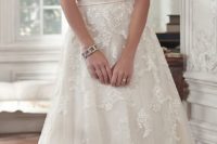 32 satin and tulle sweetheart wedding dress with an embellished sash