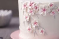 32 white one-tier wedding cake with cherry blooms
