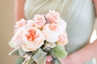 33 mint bridesmaid’s dress and a delicate peach and mint bouquet