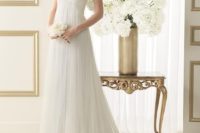 33 softly draped tulle sheath gown with empire waist and a sweetheart illusion neckline