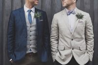 38 a striped navy jacket, a grey vest, a blue tie and an ivory striped jacket with a bold bow tie