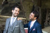 39 a tweed grey suit for one groom, a bold blue with blush touches for the second