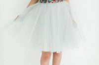 39 colorful sequin top, a white tulle skirt and red shoes