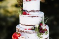 39 dirty frosted wedding cake topped with berries and fruits