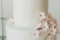 39 ivory wwedding cake topped with cherry flowers