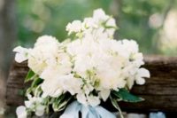 39 lush white bouquet with silk blue ribbon