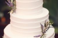 41 white frosted wedding cake with lavender sprigs