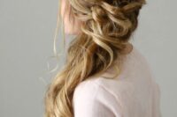 a beautiful side-swept Dutch braid with a twsited and wrapped touch and waves down plus face-framing hair