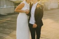 a black pantsuit, a white shirt, grey shoes and necklaces, a boho lace sleeveless A-line wedding dress are a great combo