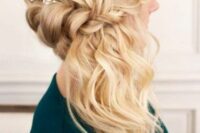 a blonde side half updo with a braided halo and waves down plus a hair vine is a lovely idea for a boho or ristic bride