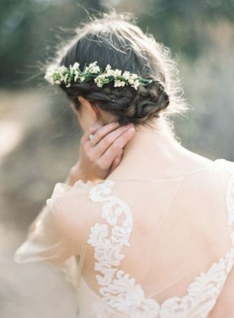 a braided side updo with a simple top and a fresh flower hairpiece is great for a delicate and a bit boho infused bride
