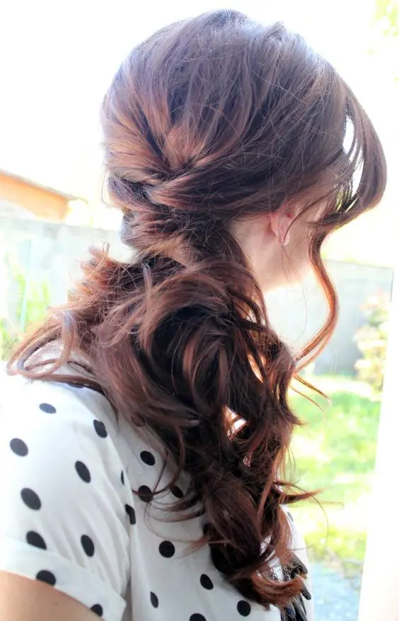 a chestnut wavy side ponytail with waves framing the face is always a good idea for long hair