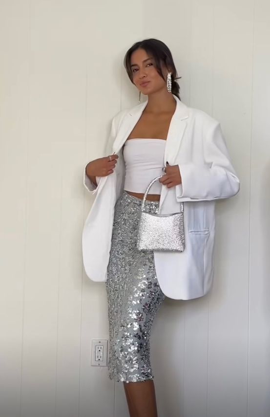 a classy party look with a white strapless top, a silver sequin midi, a white oversized blazer, a silver bag and statement earrings