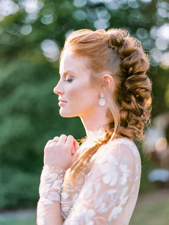 a dimensional and loose braid from top to the side with a volume on top is a lovely idea for a boho bride