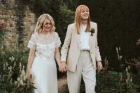 a neutral pantsuit with an oversized blazer, white shirt, brown shoes, an off the shoulder wedding dress with a pink embroidery cover up