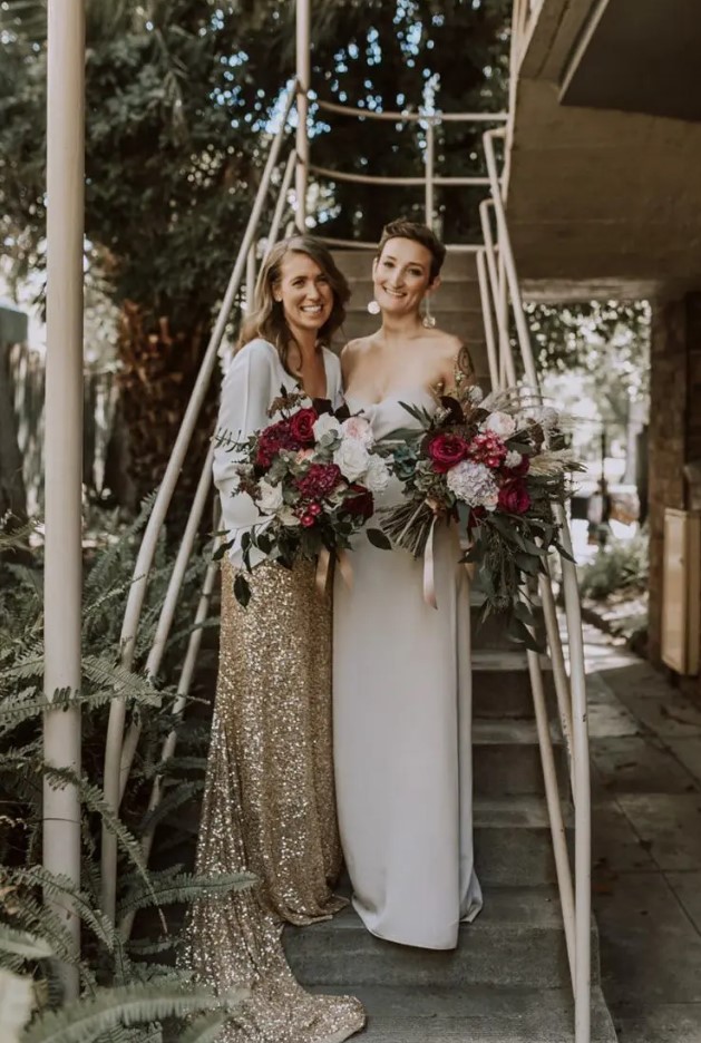 a strapless plain maxi wedding dress, a white blouse with wide sleeves and a gold glitter skirt with a train