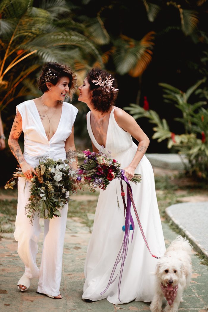 a white jumpsuit with a plunging neckline, an A-line wedding dress with a plunging neckline and lovely headpieces
