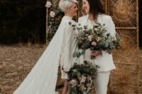 a white plain pantsuit with a white top and black sneakers, a mini high neckline wedding dress with a long capelet and floral boots