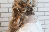 long messy wavy side-swept hair with a bump on top and a braided element plus waves down is amazing