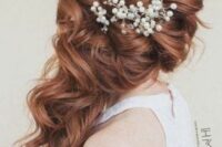 long wavy ginger side-swept hair with a bump on top and some pearls is a delicate and lovely idea for a romantic bride