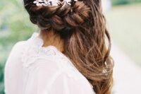 textural hair down with a braided element and waves down, with a rhinestone hairpiece is a chic and lovely idea