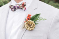 04 The groom’s look is whimsy, with a light grey jacket, a colorful plaid bow tie and a pinecone boutonniere