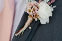 04 dark grey suit, a pink tie and fresh flower boutonniere