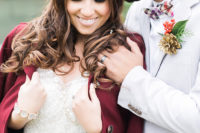 05 The bridal V-neck beaded dress was complemented with a burgundy coat
