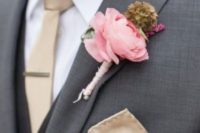 05 dark grey suit,a beige tie and a pink boutonniere