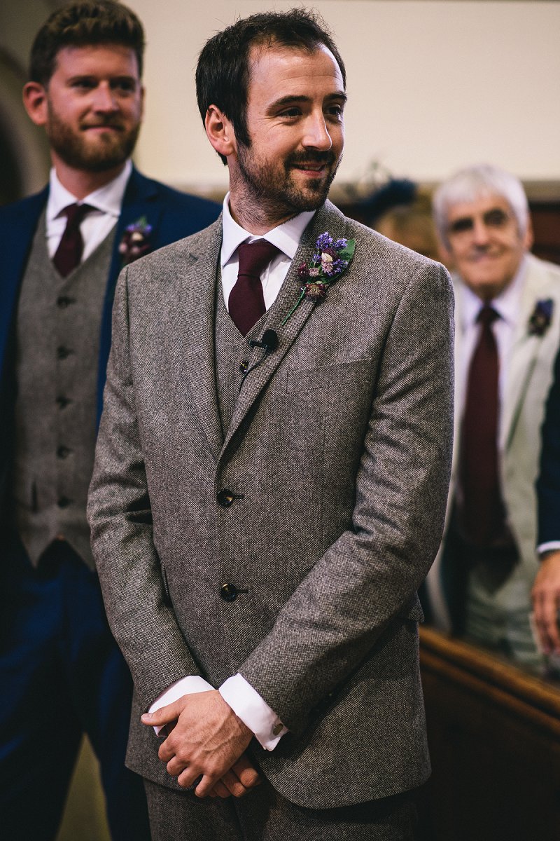 The groom was wearing a vintage inspired tweed suit
