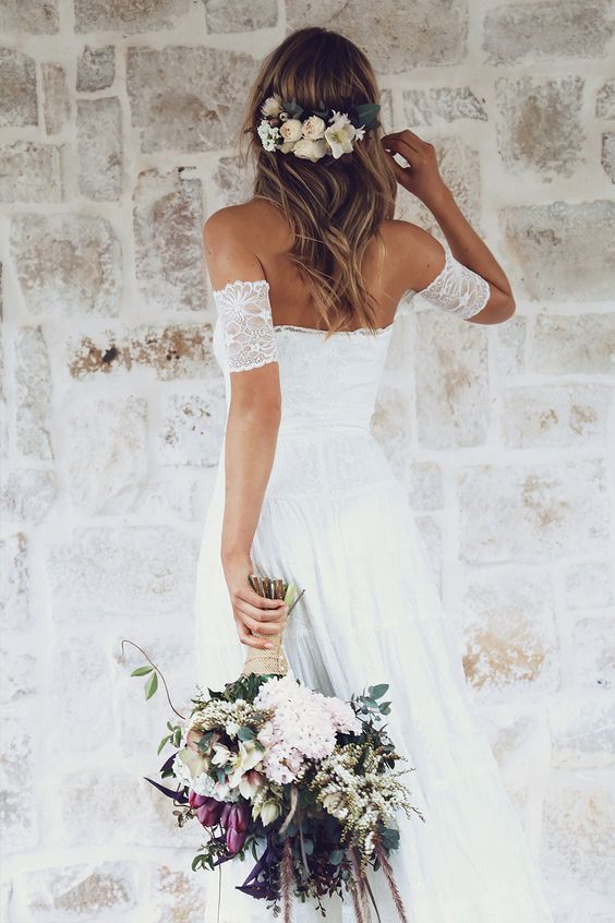 off the shoulder lace wedding dress, flowers in hair are ideal for a spring boho bride